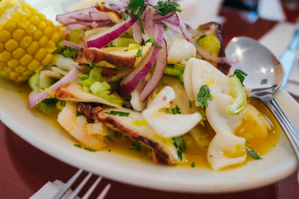 Seafood ceviche with red onion, corn and sweet potato